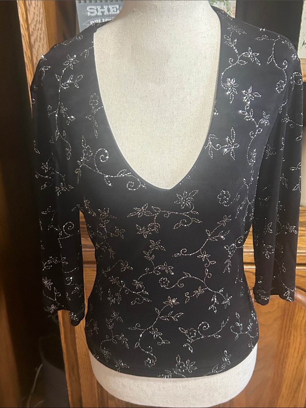 Junior’s Black V-Neck Long Sleeve Crop Top with Silver Floral Accents Small